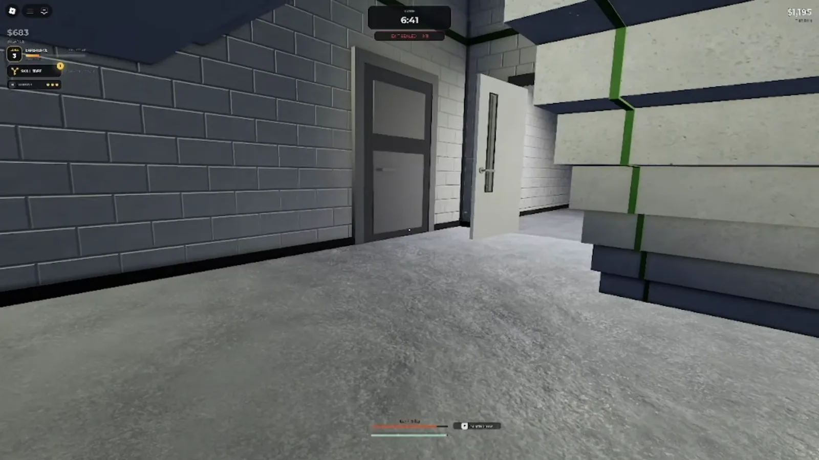 A concrete stairwell with green trim in the Steal Or Die Office, the choke point between floors